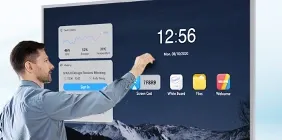 A presenter tapping a Hikvision interactive flat panel that shows a clock and app tiles