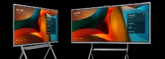 Two MAXHUB Xboard displays on rolling stands, each showing a meeting-room home screen