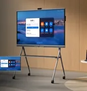 Yealink MeetingBoard Pro on a rolling stand in a meeting room, showing its home screen